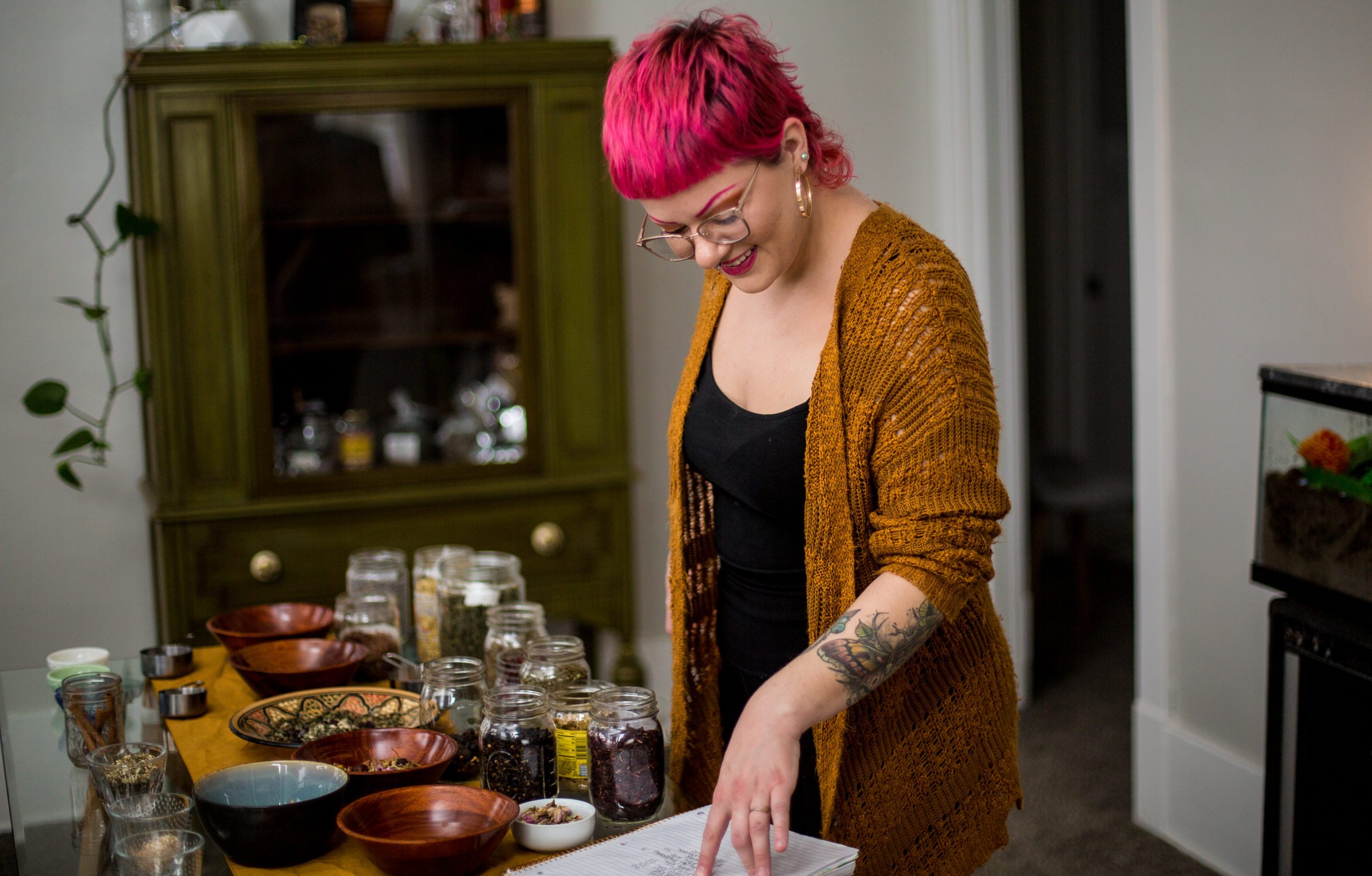 Brand photo of entrepreneur working on creating her tea blends